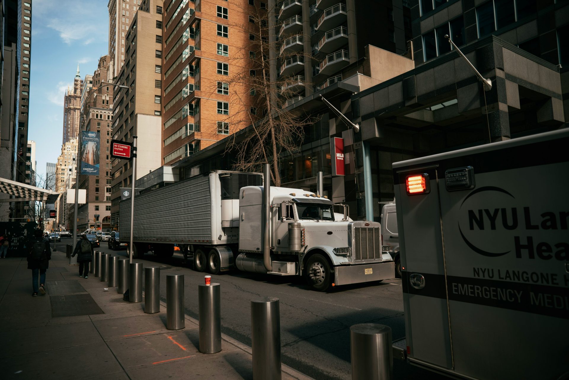 a large truck is parked on the side of the street